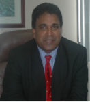 Dr. the Honourable Roodal Moonilal, Minister of Housing and Environment
